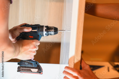 Drilling Screw Into Wooden Frame With Power Tool
