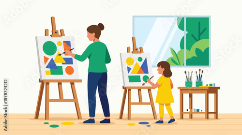 Mother and child painting abstract shapes on easels in bright studio
