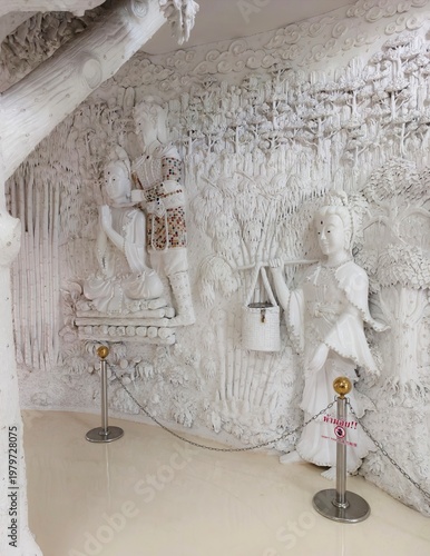 Photography Wat Huay Pla Kang ,Chiangrai,Thailand,a serene scene of a figure carrying a bask