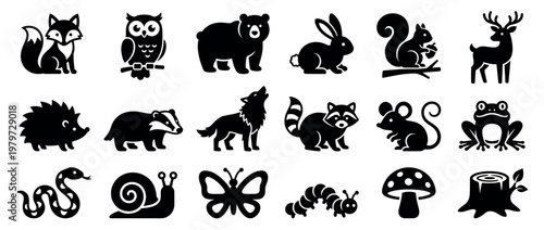 Collection of various simple black animal and nature silhouettes including a fox, owl, bear, rabbit, and deer