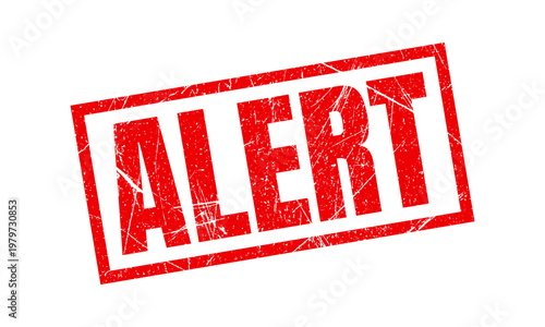 Alert red rubber stamp on white background with a red rubber stamp