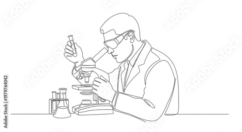 Man in lab coat using microscope.