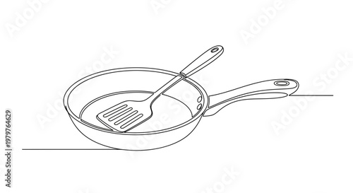 Frying pan with metal spatula inside.