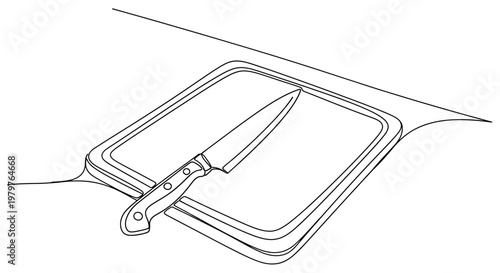 Knife on cutting board closeup view.
