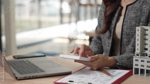 Asian female agents offer pricing and terms for buying or renting real estate, describe interior design options, and provide online home sales consulting.