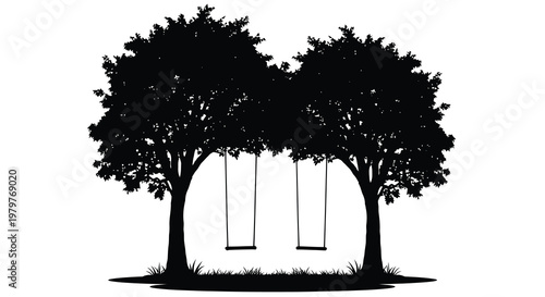 Two trees with hanging swings create a peaceful outdoor scene silhouette