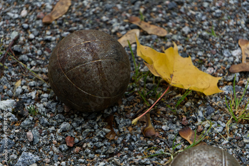 one boule ball in gravel path