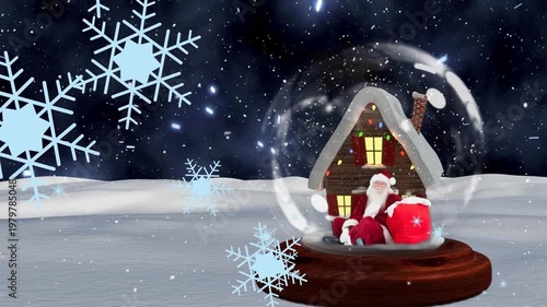 Animation of snowflakes on house and santa statue in glass sphere against snowfall on land