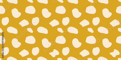 Vector seamless pattern with chaotic spots, dots, randomly scattered shapes. Simple funky terrazzo floor texture. Stylized animal skin print. Abstract repeated background. Yellow color, modern design