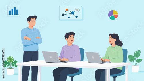 Three people working on laptops in an office