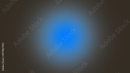 Abstract blurred bright blue light source on a dark background