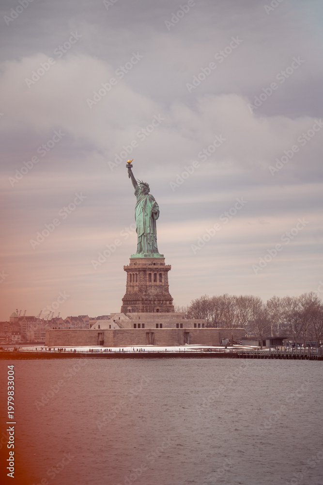 Fototapeta premium Statue of Liberty on a Cloudy Winter Day, New York Harbor, USA