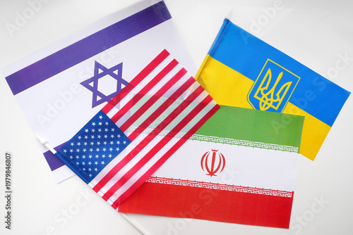 USA, Ukraine, Iran, Israel flags on white background. Mockup. Geopolitical Conflict and Diplomacy Concept