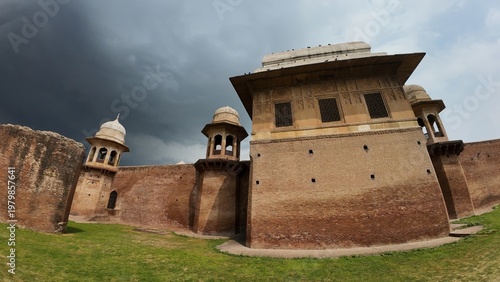 Historic Red Brick Rear Exterior Wall and Architectural Domes of Sheikh Chilli Tomb under Cloudy Rainy Weather in Kurukshetra