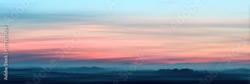 Serene Landscape with Gentle Pastel Shades of Sunrise Over Hills