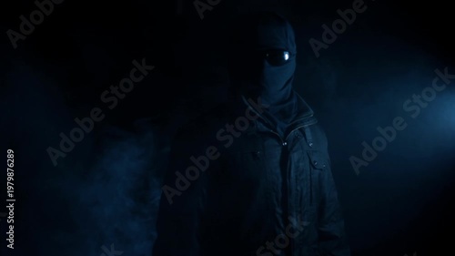 Mysterious Hooded Figure Standing in Smoke with Blue Light, Anonymous Concept