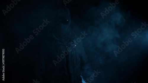 Mysterious Hooded Figure Standing in Smoke with Blue Light, Anonymous Concept