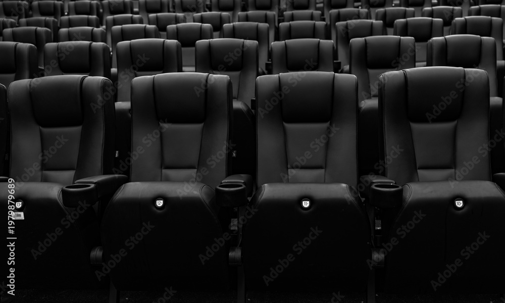 Fototapeta premium Empty black and white cinema seats in modern theater