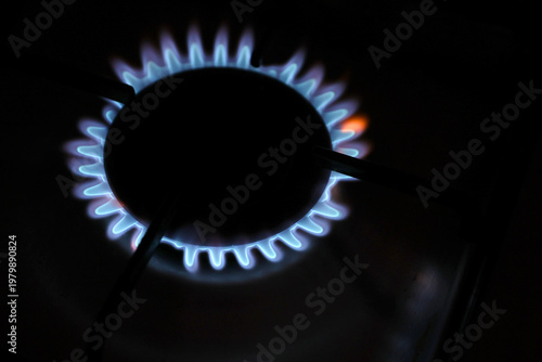 Tableau sur toile Kitchen gas cooker with burning fire, propane gas for consume.