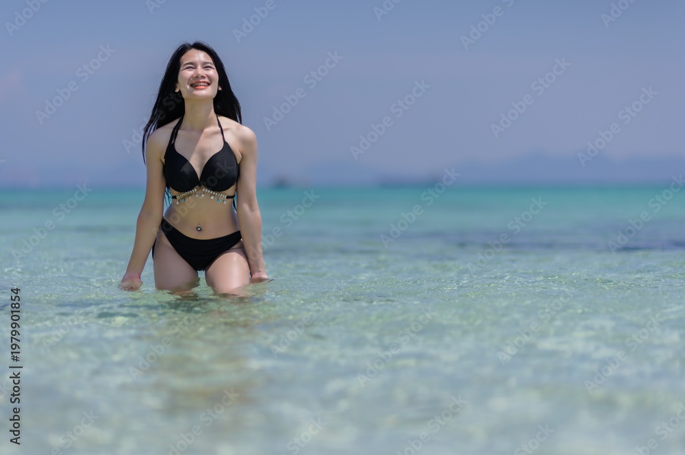 Obraz premium Woman in Bikini Enjoying Summer Vacation at Koh Si Chang Beach