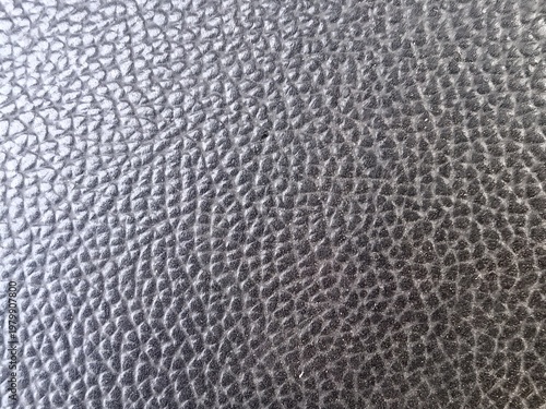 Detailed Macro Texture of Black Faux Leather Material with Grainy Surface Pattern