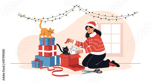 Young woman in a santa hat wrapping Christmas gifts at home while playful cats watch and help with the ribbons.