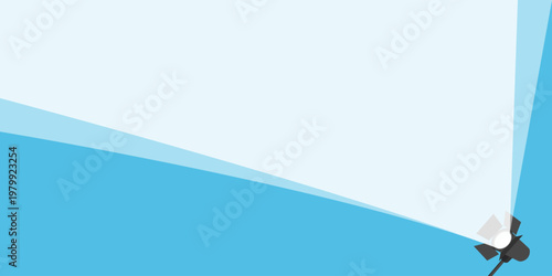 Bright spotlight beam illuminating a large area diagonally from bottom right on a blue background