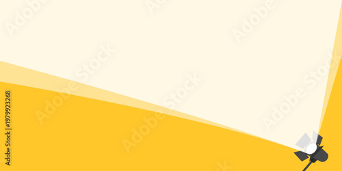 Bright spotlight beam illuminating a large area diagonally from bottom right on a yellow background