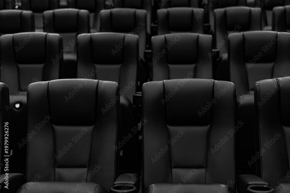 Fototapeta premium Empty black and white cinema seats in modern theater