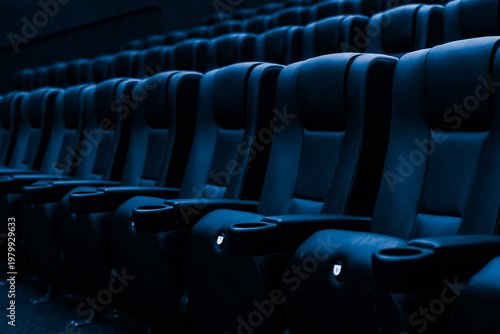 Fotografie Rows of empty blue cinema seats in modern movie theater