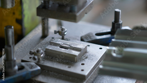 Slika na platnu Close-up view of metal stamping die during precision machining in industrial wor