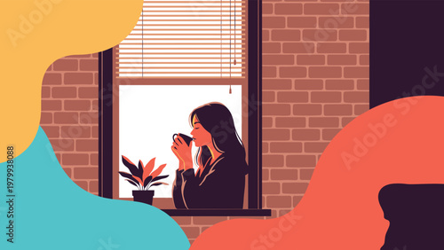 Young woman relaxing and drinking a warm beverage by a window with a view of a brick wall and indoor potted plants.