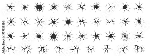 Collection of diverse black ground crack graphic elements on white background