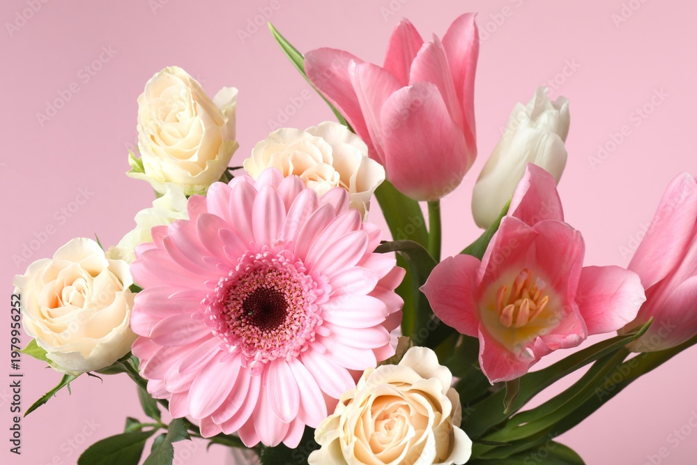 Fototapeta premium Beautiful bouquet of spring flowers on pink background. Happy Mother's Day, birthday or International women's day concept