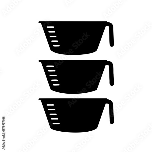 Black measuring cups stacked, kitchen utensils for cooking and baking needs