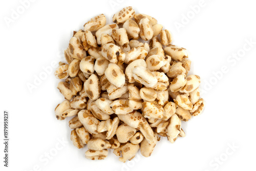 Fotografie Puffed wheat isolated on white background - top view