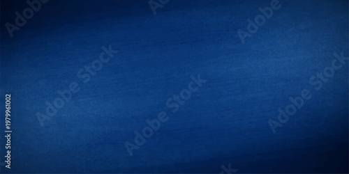 A dark blue denim fabric texture background features a rough cotton textile pattern with a vintage grunge surface design perfect for a fashion cloth backdrop or wallpaper