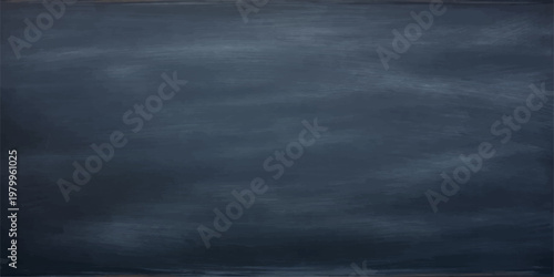 A blank dark grunge blackboard surface with a vintage chalk texture and smoke patterns against a black wall backdrop