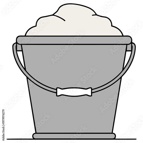 A gray bucket filled with a large amount of snow on the ground