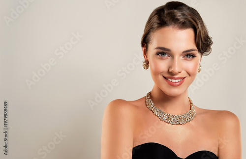Beautiful girl with gold ans silver jewelry . A set of jewelry for woman ,necklace ,earrings and bracelet. Beauty and accessories. bijouterie
