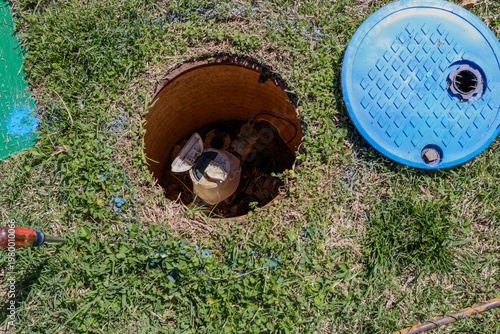 A undergound water meter in a residentsl lawn