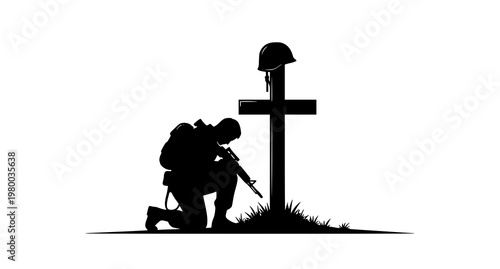 A soldier kneels in respect beside a grave marked with a cross