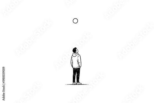 Young man in hoodie looking up at a circle against a white background