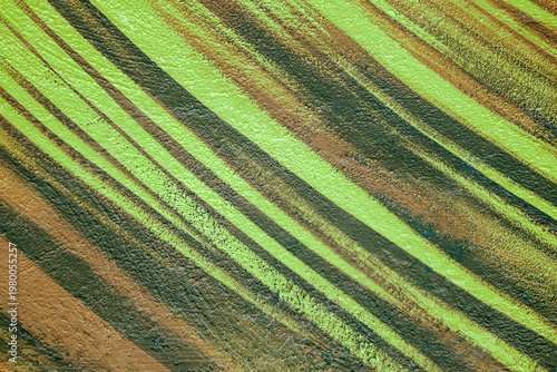 Colorful abstract brush strip drawing on the walls of the city. Striped pattern for wallpaper design. Beautiful bright colorful street art graffiti background.