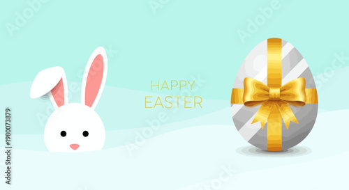 Happy Easter bunny peeking from behind a snowy landscape with a decorated egg and golden ribbon