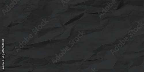 Vintage aged brown cardboard with a rough wrinkled texture and creased grunge pattern provides a blank crushed paper surface for a crumpled black sheet backdrop design