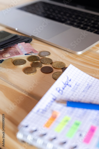 Analyzing personal budget and expense planning with laptop