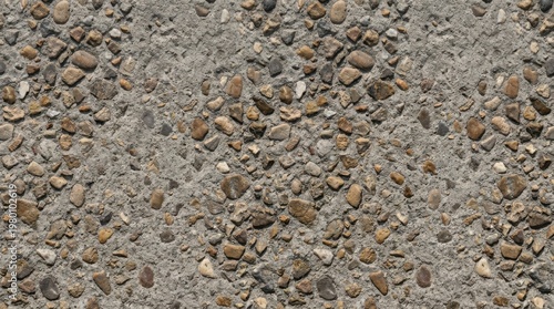 Textured Ground Surface: A close-up view reveals a rough, textural ground surface composed of small stones embedded in concrete, offering a study in natural and man-made materials.