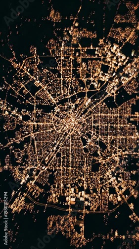 Aerial city night light urban grid illuminated architecture pattern glowing metropolis landscape with modern infrastructure, mesmerizing street network, circular symmetry, and vibrant downtown design