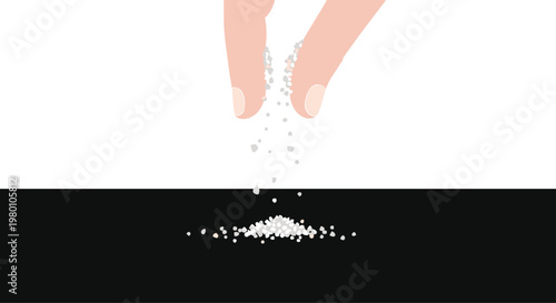 Human fingers are sprinkling fine white grains onto a solid black surface, creating a small and delicate pile at the bottom of the frame composition.